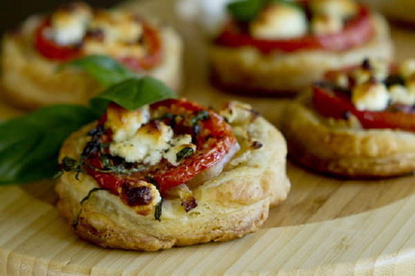 Tomato and Goat Cheese Tarts. Treat your guests with this perfect savory appetizer or side dish. They must enjoy the sweet flavor of tomatoes and the goat cheese makes the perfect compliment with the pastry.