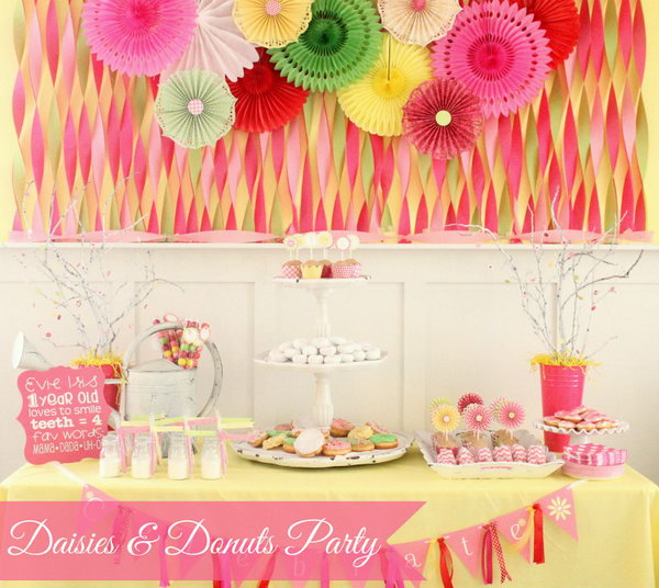 Daisies and Donuts Party Idea. So many girls dream about a party of sweet and fresh flavor. This daisy and donut party will turn the princess’ s dream into reality by its accordion fans and tissue fan backdrop, a huge tiered stand with a series of donuts, and cookies served to finish off its sweet and beautiful outlook.