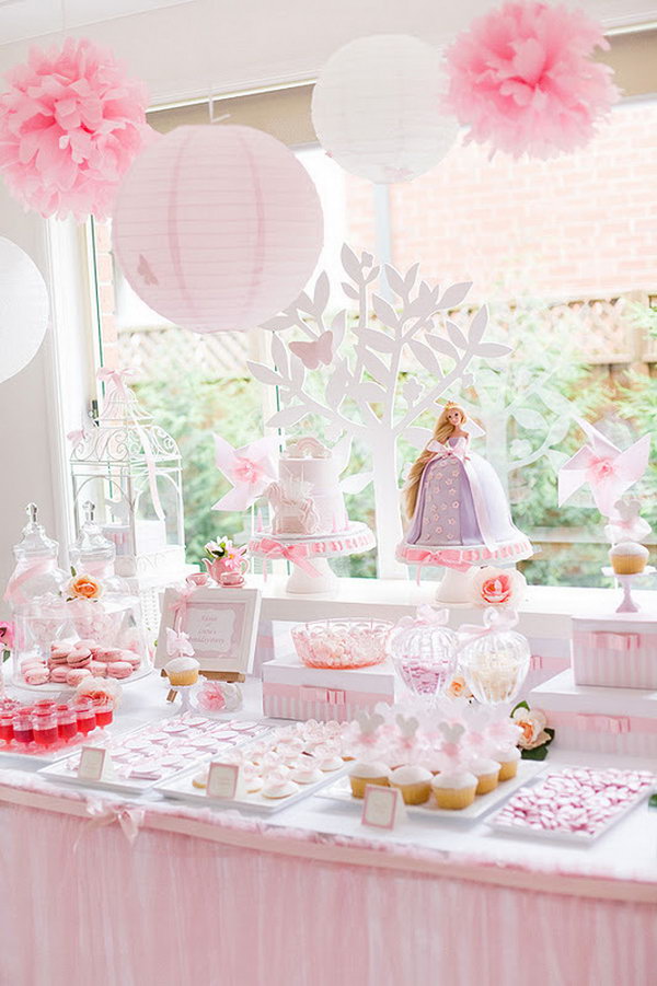 Enchanted Garden Princess Party. This dreamy garden party features its sweet stands with a series display of ribbon candies, sweet cupcakes, cookies and red drinks. The pink and white paper lantern garland decorated with tissue flowers adds up sweet and delicate touch to this party.