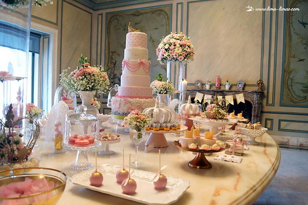Gorgeous Princess Birthday Party. The gorgeous six-tiered princess cake is really stunning with the beautiful floral arrangements setting around it. The cute gold and pink ruffled cake balls, mini stacked cakes with gold crowns and lace patterned favor boxes add up more elegant sense to the party spread. Seriously spectacular for such an event.