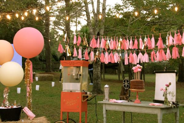 Summer Party Tassel Garland. Incorporate tassel garland with strung outdoor lights for an adorable theater themed decor to set up the tone for your summer party.