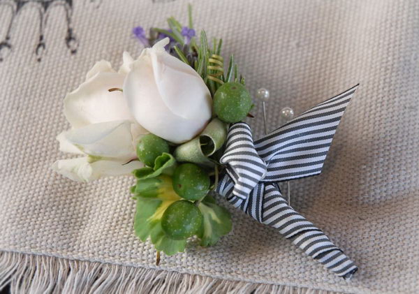 DIY Groom's Boutonniere. Select flowers and foliage to use in your boutonniere. Cover the stem part with floral wire and balance your floral arrangement with floral clippers. Finish it off with ribbon decorations.