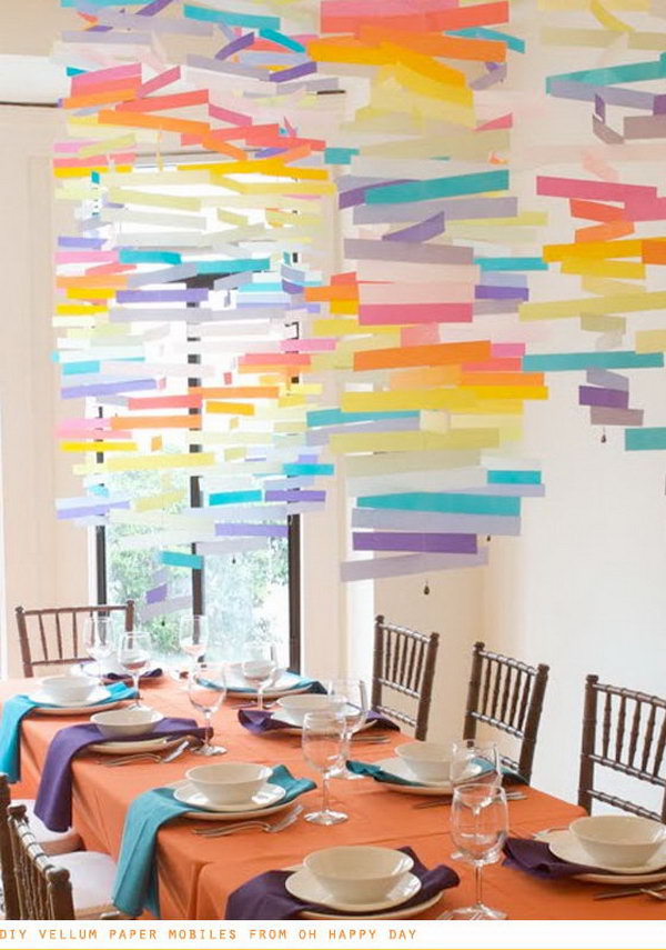 DIY Vellum Paper Mobiles. Use vellum paper and a sewing machine to hang some mobiles for a playful decor detail. This colorful hanging art piece will be bound to impress your wedding ceremony.