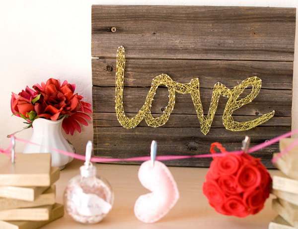 Decorative Mural. It's fantastic to decorate your wedding reception with this stunning love board mural. Cut a love word and post on the board, lock in a nail with two sides, remove the word and use colorful rope as you like to wrap around the nails.