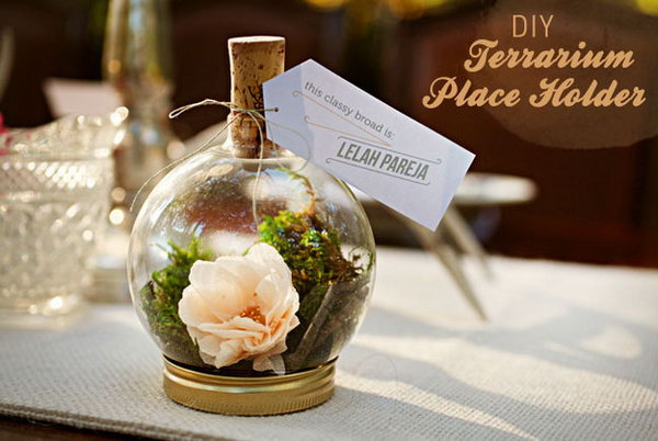 Tiny Terrarium. At wedding receptions, guests may not know where to sit. Direct guests where to sit with this identifiable tiny terrariums for decorative place card application.