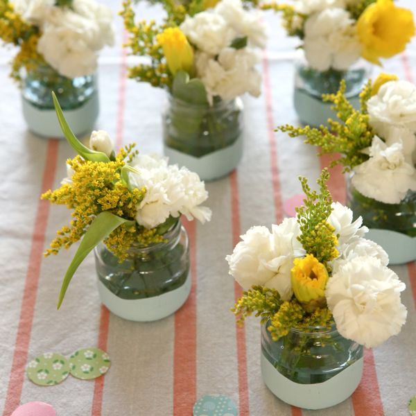 Dip the Jars in Paint. Dip the jar into the bowl filled with paint. Fill with flowers or tea lights to make beautiful decor for your celebration when they are dry.