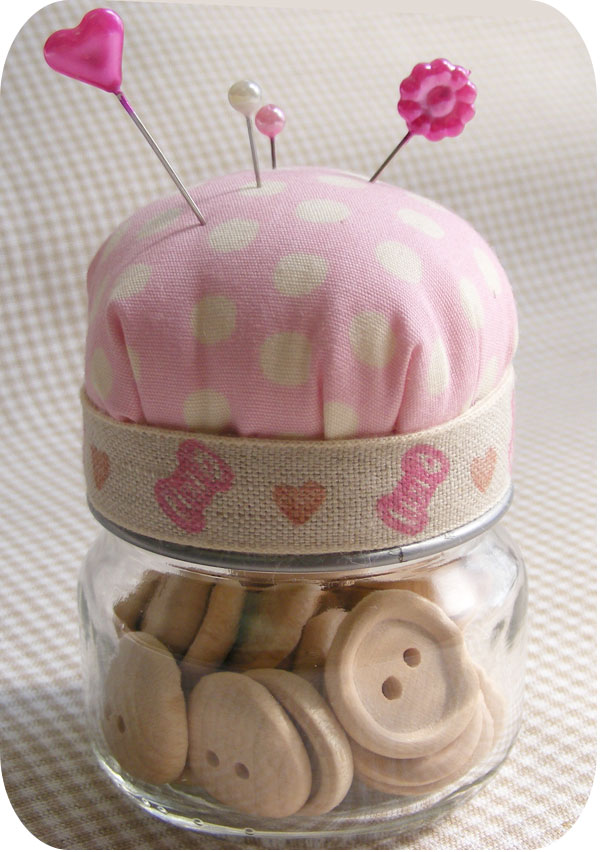 Baby Food Jar Pin Cushion. Make the pin cushion from pink fabric and fluffy pillow stuffing. Glue pincushion at the top of the jar lid and use beautiful ribbons to cover the side of the jar lid. It's fantastic to repurpose your jar in this way.