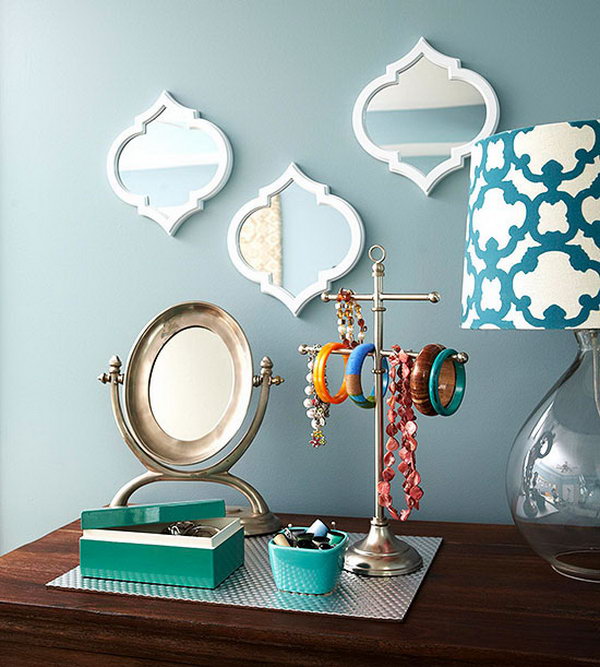 Decorative Storage Idea. This pretty trio of mirrors with a place mat to gather jewelry serve as a charming mix of decorative accents and practical storage.