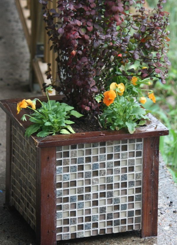 Gorgeous Tiled Wooden Planter for Garden Decor. The wooden planter for the garden decor is more durable by adding some gorgeous tiles. See more here.