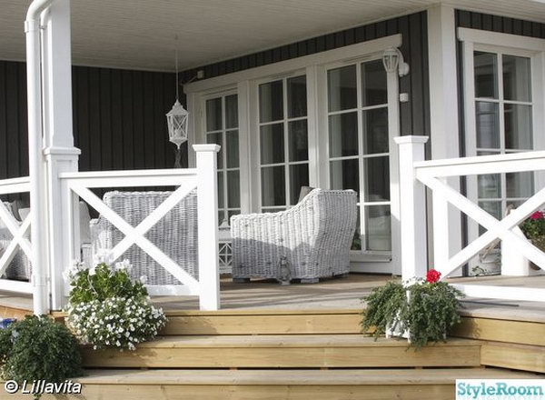  Natural color deck and the white X-shape railing. Stylish X-shape decorations become more and more popular these days. Awesome white X-shape rails add to a delicate custom look to the natural color deck.  