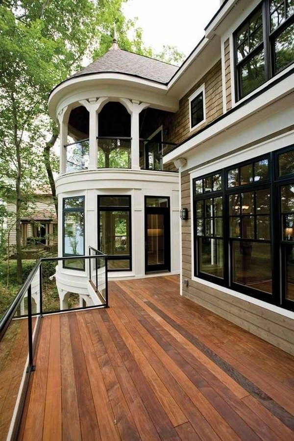  Stay beautiful - Traditional deck with glass deck railing. Adorable gazebo glass system coordinates perfectly with the French doors, double-hung windows and the deck.  The glasses allows unobstructed views and they are barriers against the wind. 