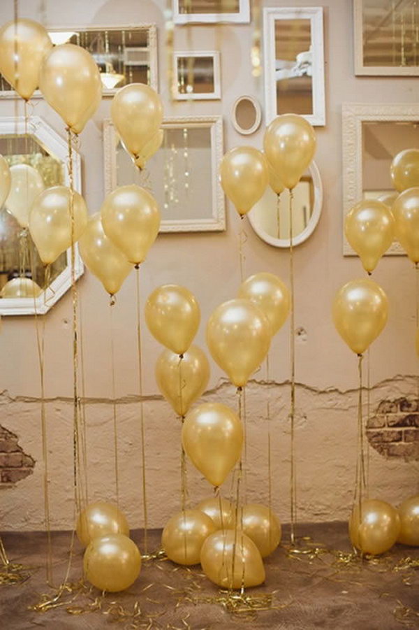  Start with the arrangement for the wedding with helium balloons tied golden ribbons and mirrors on the wall in the space. This is super divine. 