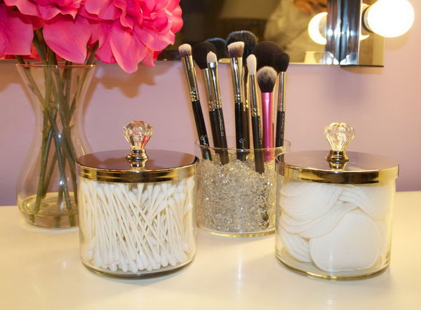 DIY makeup brush holders from empty candle jars. What a super easy project for your makeup storage.