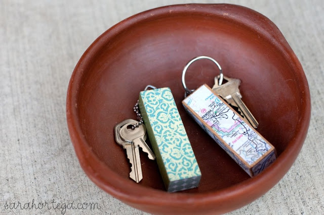 Jenga Keychain. Screw eye into the block, apply mod-podge to the map paper and place on the Jenga block, attach the key ring to finish off this gorgeous artwork for beautiful decor.
