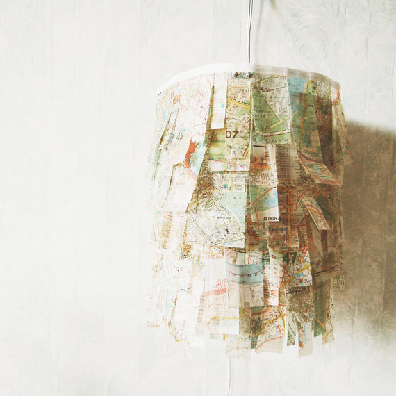 City Lamp Map Art. Add mod-podge to map paper to make it stronger and more transparent. Use the treated map paper to wrap up the lampshade. Place energy saving bulbs in the lamp to finish off this unique and lush lamp which is perfect for dining table lighting.
