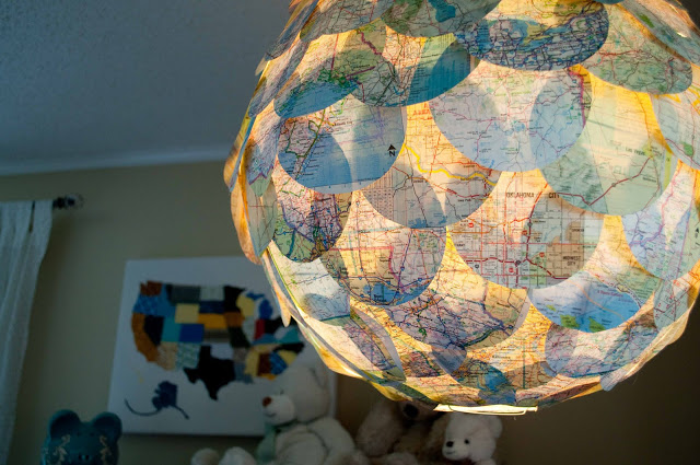 DIY Map Pendant. Glue dozens of cut-out circles on the white plain paper lantern. At night time, you'll be amazed at the soft light ambiance.