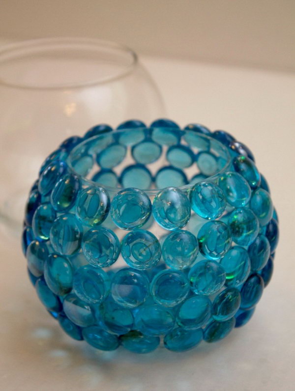 Creative Glass Bead Vase. This craft is quick, easy and cheap to make.It would be great for table centerpieces, gift ideas, wedding decorations and much more. All you need to make these is a small oval glass container, bag of glass beads, glues sticks and a hot glue gun. All of these items can be found at the Dollar store. 