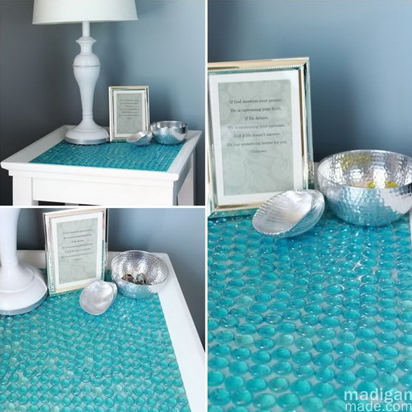 DIY Tile Table with Glass Gems. You can turn a boring old side table into something beautiful and seemingly expensive with a package of glass gems or stones at the Dollar Store. It’s really a great project for sprucing up your home decor. 