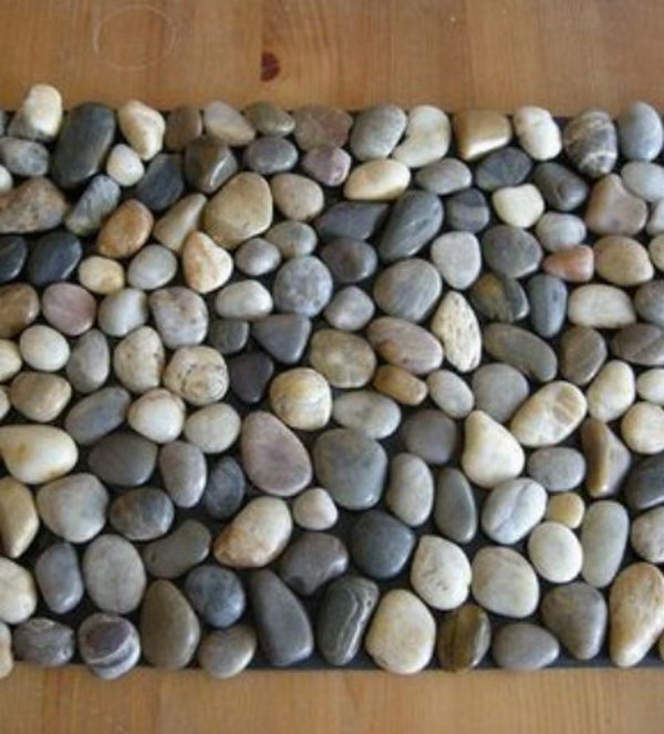 DIY Pebble Bath Mat. This one takes a lot of patience to complete, but you can do it and it is a far cry cheaper than paying someone else to do it or buying the tile from a tile store. It is ideal to put in the bathroom to prevent the slipperiness. The instruction is here.