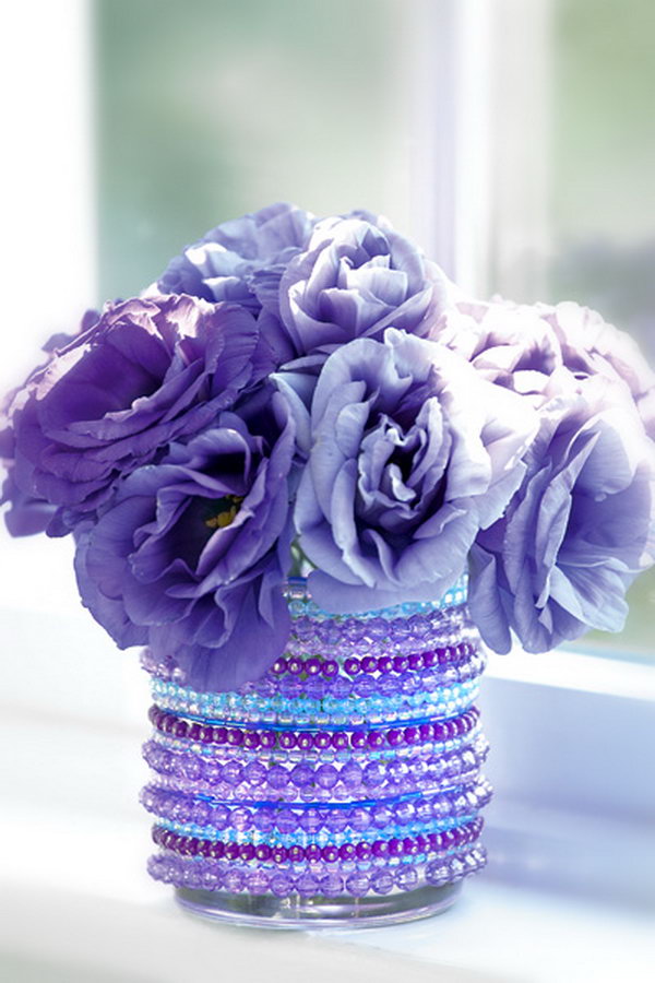 DIY Jeweled Vase. Here is another creative idea to create the custom vases. Dress up a vase, glass, or jar with a few strands of sparkly beads from the dollar store to make this jeweled vase. 