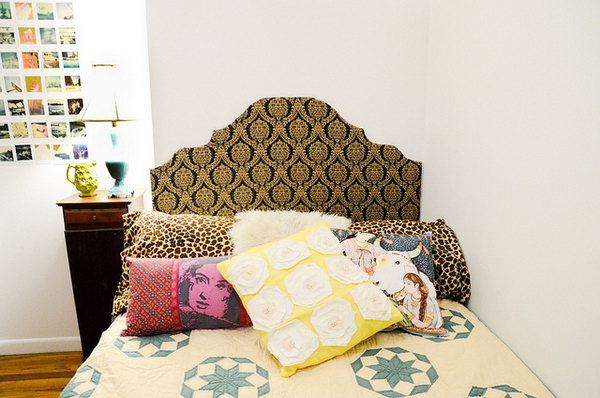 Cut out headboard according to the shape you like, tape the fabric to cover the board completely, hang the headboard behind the bed to add up a beautiful decor for your dorm room.