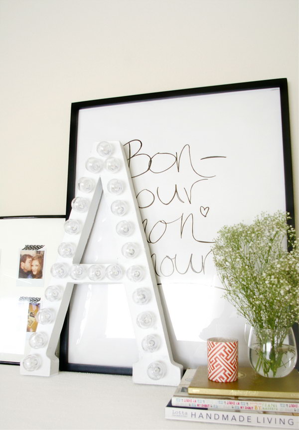 DIY Marquee Letter. Cut along the letter from the cardboard, cut an asterisk to push the bulb, twist the lights into place to tuck excess cord. It serves as a fashionable decor for your dorm room and gives off elegant illumination as well for girls.