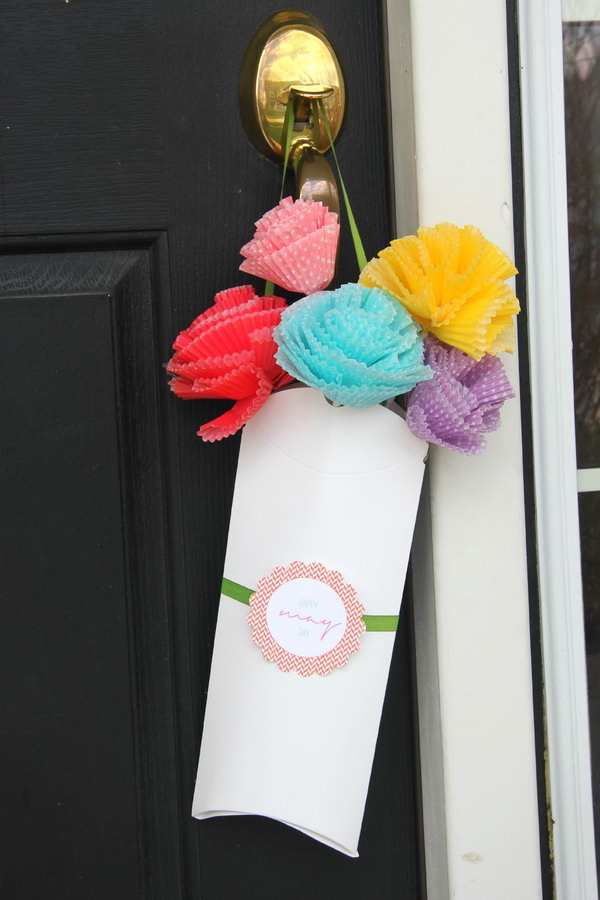Pillow Box Bouquet for May. Make colorful flowers in various sizes from the cupcake liner and glue to the straw. String ribbon through the punch holes, add the tag and slide the flowers into the box to catch everyone's attention with this beautiful bouquet in May.