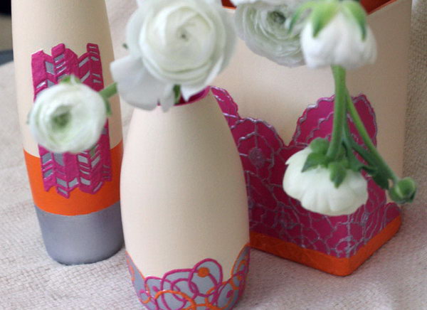 DIY Textured Clay Vase. Use puffy paint to draw or trace your design, paint your vase and spray with sealant and you'll get this lovely textured, clay-like vase. Just display your pretty spring blooms to show off this floral sets.