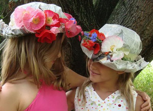 Floral Hat. Place sheets of newspaper over head and mold to shape. Tape around the head, add flowers and tape in place. Roll brim at the forehead to finish off this gorgeous floral hat.