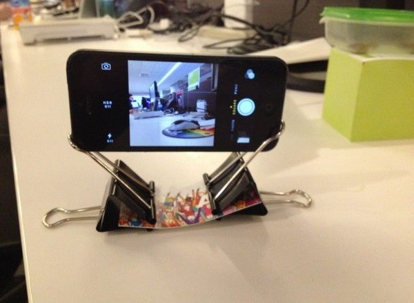 This phone stand with binder clips and a business card is pretty cool.