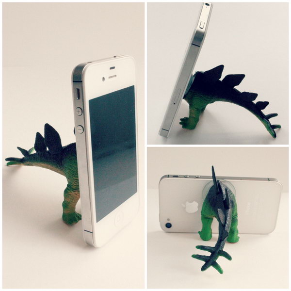 Dino iPhone Tripod. Cut your dinosaur in half, inject it with caulking, dab a little caulking on the feet and tail as well to avoid sliding. It's super easy, funny yet inexpensive.