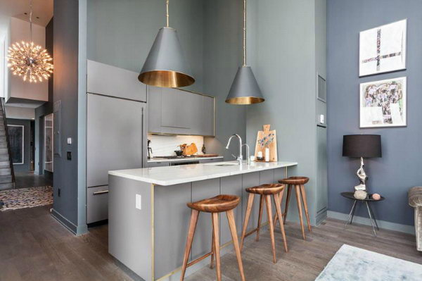  Industrial kitchen with Trendy Glamour. This stylish  smoke grey kitchen has a trendy and attractive outlook. I love every detail of this kitchen, the pendants, the wall paint, the wall art, the custom stools and all.
