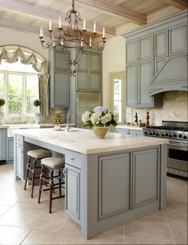  Pastel-Colored Kitchen. The colours are warm and so comfort and restful. This kitchen island is accented with beautiful classic green cabinets and lighting fixtures.
