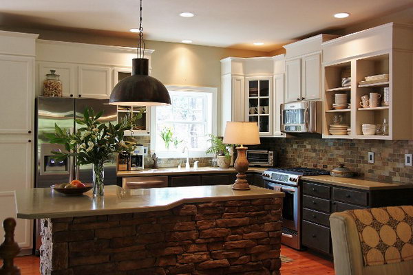  Both functional  and glamorous. In this white kitchen, the rustic stone island was made in a crazy shape. And the designer decided to put stools around it. Love the white cabinets and the light fixture. 