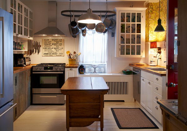  Small antique island. This adorable kitchen looks attractive for its simplicity and neat feeling which is casual and inviting.Look at the woods, the white, the lighting and the old dresser island.  It has an eclectic mix of vintage, industrial and rustic that works. 