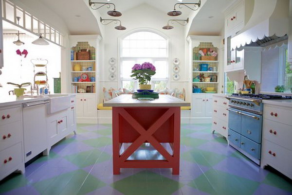  Coral-colored island. This chic cottage kitchen is really a different one. Every detail is  elaborately made. White kitchen, painted wood floor, red island, blue range...beautiful!