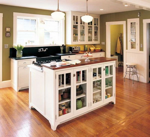  Island combines stove and storage.This custom-made movable kitchen island with plate rack and stove not only offer original storage strategies, but also offer a convenient display opportunity and keep the room from feeling confined. 