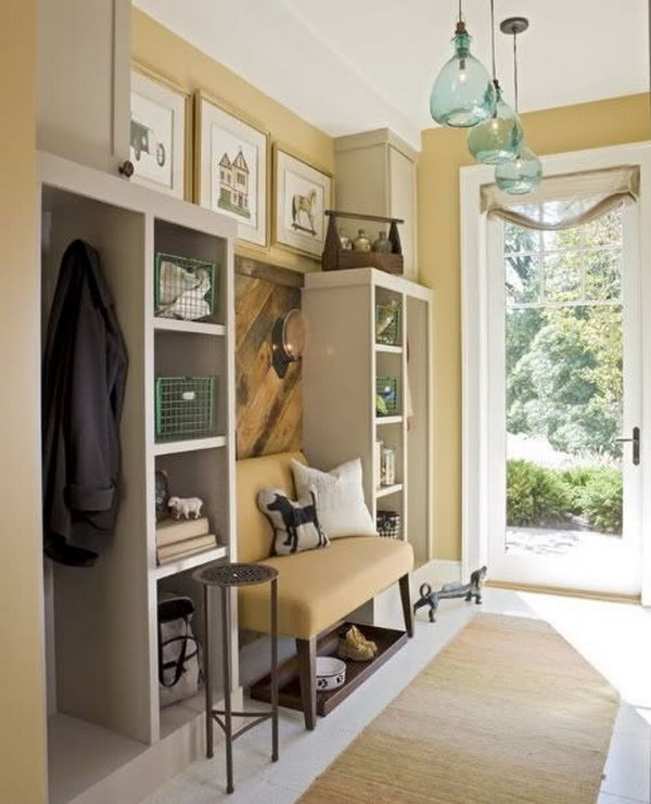  Neutral color mudroom. This yellow mudroom is too pretty to be a 'mud room'. The layout of color is perfect and gives the space a warm and cozy look. 