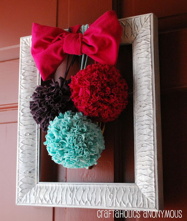 DIY T-shirt Pom Poms. T-shirt pom poms are so much more durable than tissue paper to hang on the door. They are so whimsical and fun and also great for adding color to any room. You can make some in different colors with the tutorials below. 