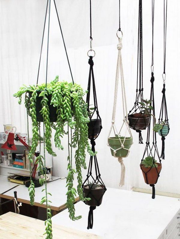 T-shirt Plant Hanger. This is a really simple DIY project for any crafter  - all you need to be able to do is to twist and knot t-shirt strips to make these cute hanging planters. Add your flower pot into the center - pot a flower or plant - hang on your deck or in your bedroom - and enjoy! 