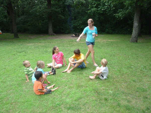 Drip Drip Splash. Everyone sits in a circle and the only person walks around it, dump the water to the selected person, then they chase each outside and go back to the spot. If you get tagged you are the only person who walks around. It's funny and the kids can cool off on summer days playing this game.