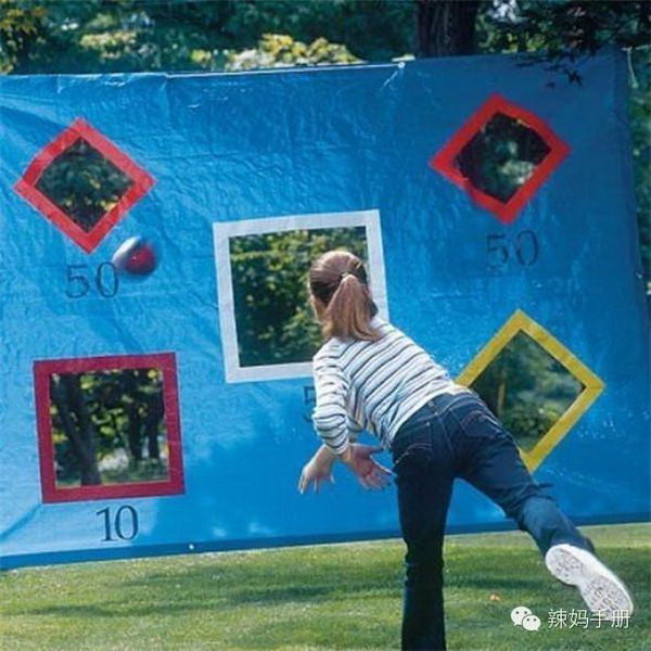 DIY Throwing Tarp. This game is super easy yet funny for your kids to get active in summer. Take a tarp, cut some squares, tape the cuts and hang with ropes and play ball with marker to designate points.