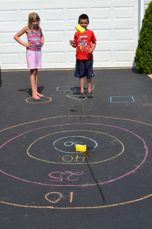 Sponge Bullseye. Draw a bullseye and assign score for each circle of the target. The kids toss their sponge at the starting line. It's great to train your kids' throwing accuracy in this funny way in summer.