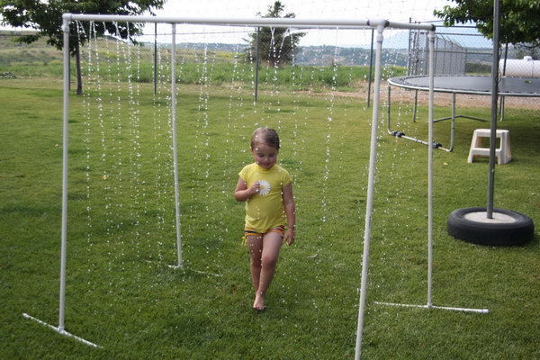 PVC Pipe Sprinkler. Prime your pieces and cement them into place. Drill random holes and turn the hose on as high as you can for the strong water stream. It can't be cooler for your kids to walk through on a hot summer day.