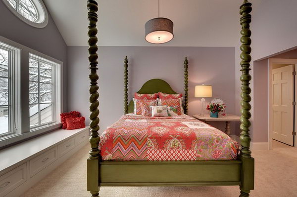 Eye-catching Green Bed: Lavender walls in contrast with the  4- poster green bed add to drama to this bedroom. The large window let light in and keep this room visually spacious. The white  built-in seat is both a reading nook and storage- such clean lines in this room. 