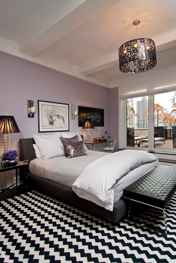 Purple and Black: The purple works with the black, Notice all the details :Beautiful Light Fixture, the ceiling, mirrored tables, wallpaper color,  furniture pieces,  the iced mauve with black and white rug  isn't so overwhelming.