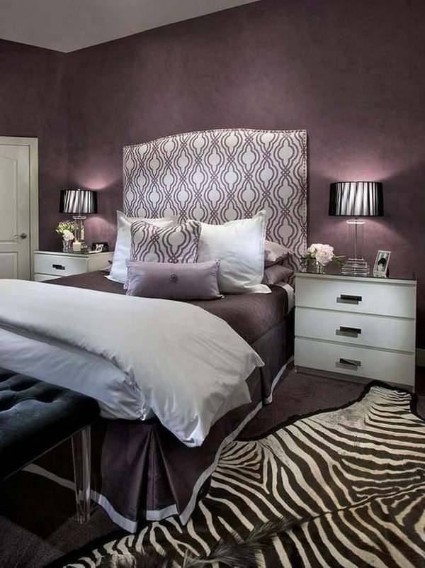 Headboard and Zebra Rug Accents: This bedroom oozes glamour with its mix of purple hues and the beautiful headboard and the eye-catching zebra rug.