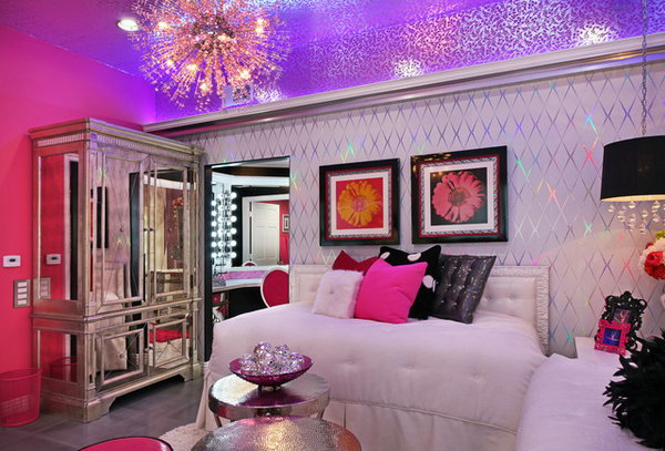 Shining Ceiling: The bright sparkly foil wall paper on walls with pink walls and the mirrored and shiny armoire are gorgeous. The shining silver leaf ceiling and the splashy pink crystal light fixtures work well together, add interest, and make this already glamorous setup even more scintillating. 