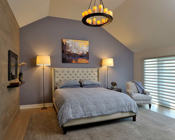 Benjamin Moore 2118-40 'Sea Life':Purple as an accent wall behind bed... adds drama to the tufted linen headboard and original art. Tall glass lamps complement the headboard and ceiling height. Candle chandelier adds ambiance.