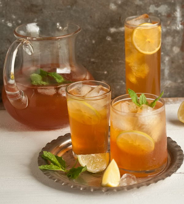 Home-made Ice Tea with Ginger, Mint and Lemon. This affordable  and tasty summer drink  is super easy to make at home.  Brew a strong jug of tea and keep it  in the fridge after its cooled, then pour it over a glass filled with ice to dilute it and cool it down even further. 